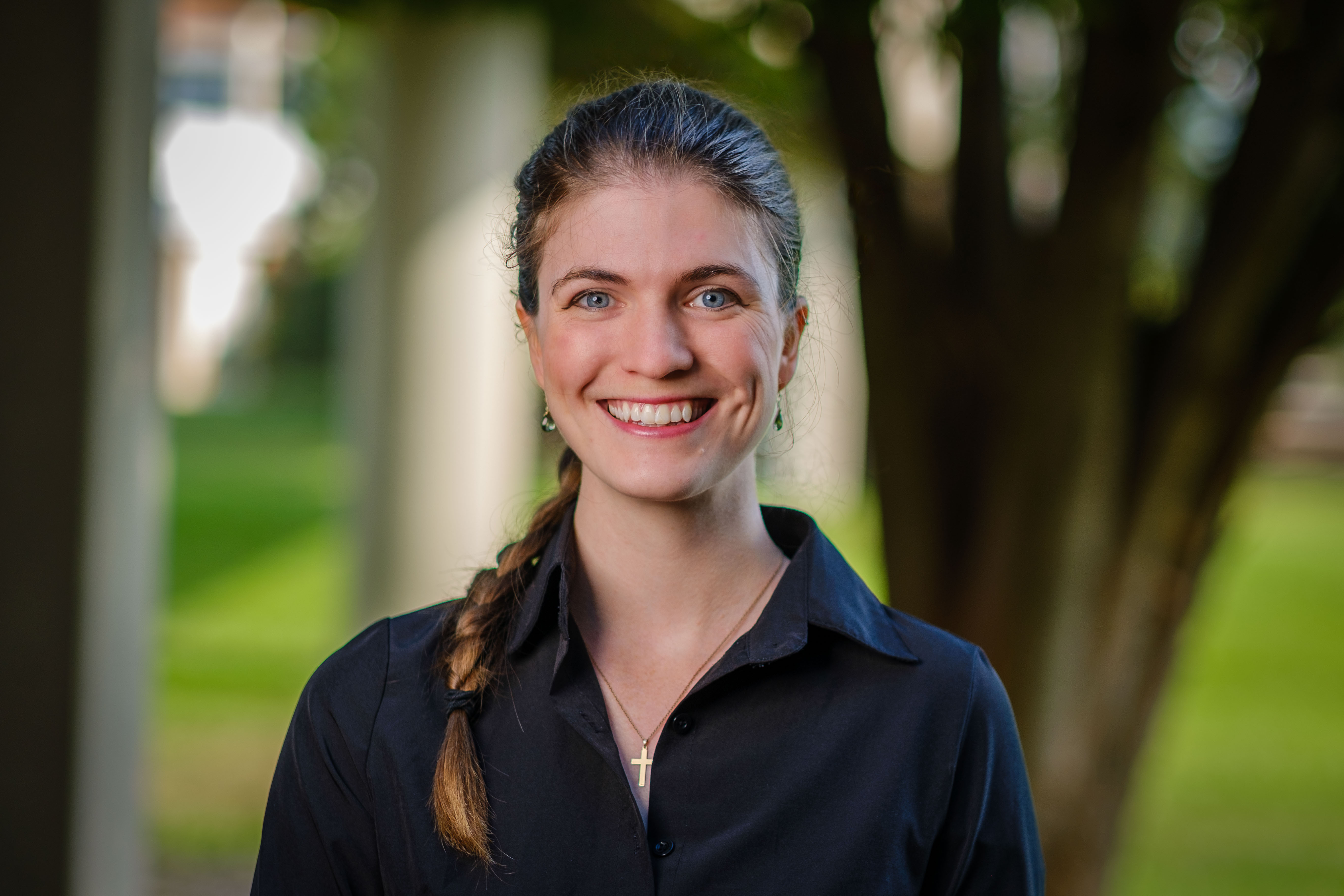 portrait of Glenna Joyce wearing a black button up outdoors